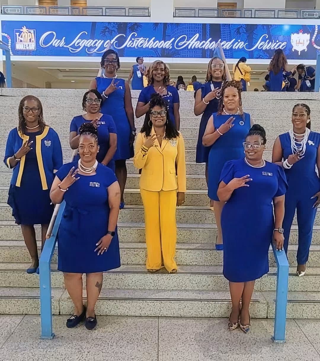 Xi Gamma Sigma members showing sorority hand signs at Boule 2026 in Tampa, Florida